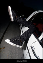 Load image into Gallery viewer, PowStar Jumbo Strap Glitter Black — Paris campaign on-foot photo
